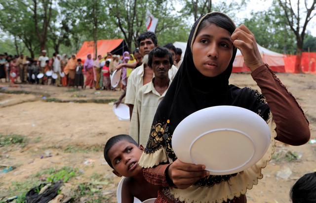 Rohingya refugees line up to get food from Turkish Cooperation and Coordination Agency (TIKA) near Balukhali refugees camp near Cox's Bazar, Bangladesh. (REUTERS) Rohingya refugees line up to get food from Turkish Cooperation and Coordination Agency (TIKA) near Balukhali refugees camp near Cox's Bazar, Bangladesh. (REUTERS)