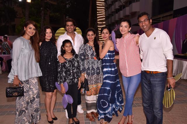 Gauahar Khan poses with the hosts, Karanvir and his wife Teejay.