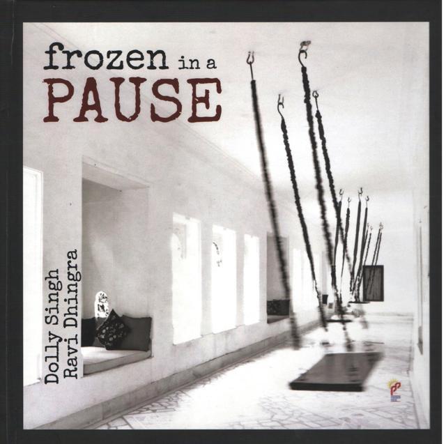 The book cover of Frozen in a Pause, a photo poetry book by photographer Ravi Dhingra and poet Dolly Singh. The book cover of Frozen in a Pause, a photo poetry book by photographer Ravi Dhingra and poet Dolly Singh.