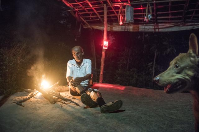 Chandu Jadhav, one of the tribal leaders at Aarey and resident of Vanicha Pada, stays up all night protecting his village by lighting a fire outside his home. His dog Tommy stays by his side and his been attacked by leopards on a number of occasions this year. (Satish Bate/HT Photo) Chandu Jadhav, one of the tribal leaders at Aarey and resident of Vanicha Pada, stays up all night protecting his village by lighting a fire outside his home. His dog Tommy stays by his side and his been attacked by leopards on a number of occasions this year. (Satish Bate/HT Photo)