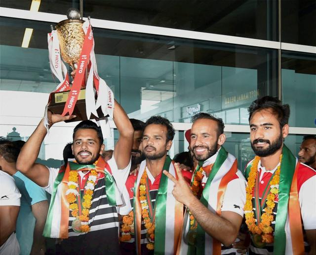 Indian Hockey team players pose with the Asia Cup 2017 trophy on its arrival at IGI Airport in New Delhi on Monday. (PTI)