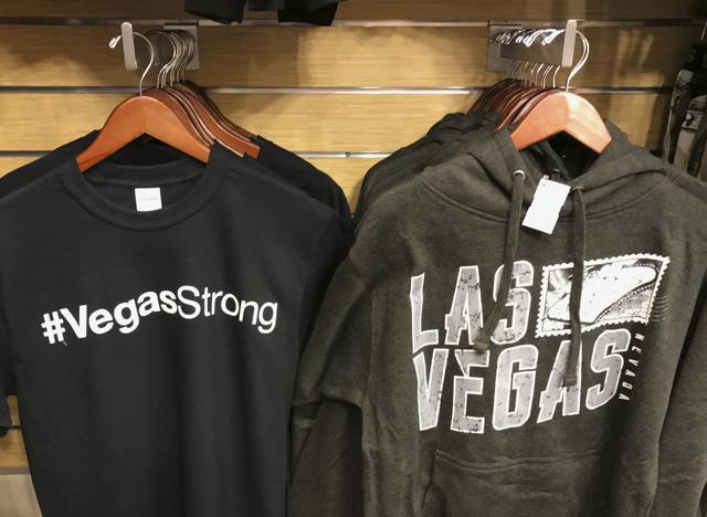 In this Thursday, October 19, 2017 photo, T-shirts for sale with #VegasStrong hang at a gift shop at McCarran International airport in Las Vegas. (AP) In this Thursday, October 19, 2017 photo, T-shirts for sale with #VegasStrong hang at a gift shop at McCarran International airport in Las Vegas. (AP)