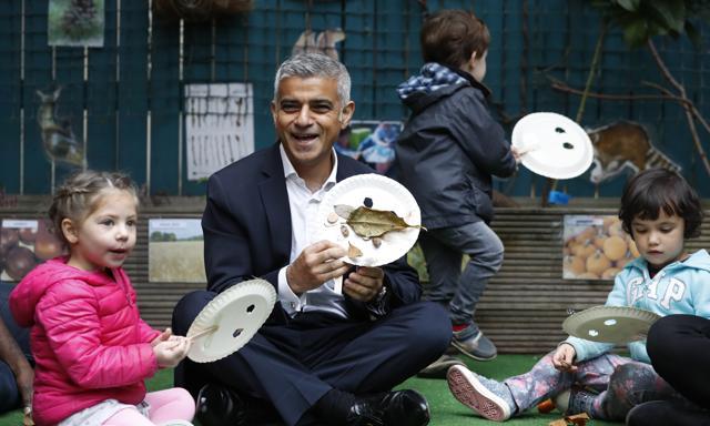 London mayor Sadiq Khan meets children at a nursery on the day he officially launches the T-Charge, the world's toughest pollution charge. The T-Charge will be the toughest vehicle emissions standard of any world city, affecting the oldest and most polluting vehicles. (AP)