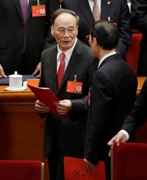 China's Politburo Standing Committee member Wang Qishan (centre), the head of the anti-corruption watchdog, leaves after the closing session of the 19th National Congress of the Communist Party of China at the Great Hall of the People in Beijing on October 24, 2017. (Reuters)