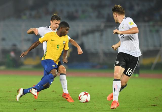 Alexander Nitzl (L) of Germany and Lincoln (2L) of Brazil compete for the ball during the quarterfinal football match of the FIFA U-17 World Cup in Kolkata on October 22, 2017. (AFP) Alexander Nitzl (L) of Germany and Lincoln (2L) of Brazil compete for the ball during the quarterfinal football match of the FIFA U-17 World Cup in Kolkata on October 22, 2017. (AFP)