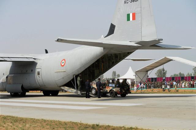 Personnel display skills next to an Indian Air Force Hercules C-130J aircraft that landed on the Lucknow-Agra Expressway. (PTI Photo) Personnel display skills next to an Indian Air Force Hercules C-130J aircraft that landed on the Lucknow-Agra Expressway. (PTI Photo)