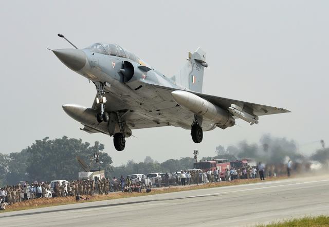 An Indian Air Force Mirage 2000 fighter jet lands on the Lucknow-Agra Expressway during an IAF drill in Bangarmau, in Unnao district on Tuesday. (PTI Photo) An Indian Air Force Mirage 2000 fighter jet lands on the Lucknow-Agra Expressway during an IAF drill in Bangarmau, in Unnao district on Tuesday. (PTI Photo)