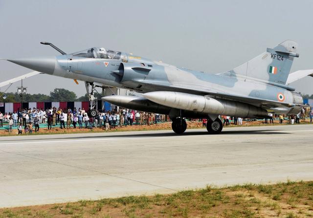 An Indian Air Force Mirage 2000 fighter jet lands on the Lucknow-Agra Expressway during an IAF drill in Bangarmau, in Unnao district on Tuesday. (PTI Photo) An Indian Air Force Mirage 2000 fighter jet lands on the Lucknow-Agra Expressway during an IAF drill in Bangarmau, in Unnao district on Tuesday. (PTI Photo)