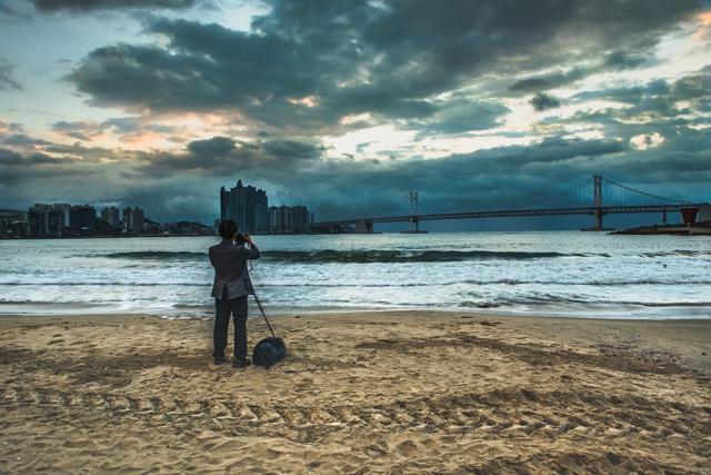 Tourists are shooting Gwangan Bridge and Haeundae at Busan, South Korea. (Shutterstock ) Tourists are shooting Gwangan Bridge and Haeundae at Busan, South Korea. (Shutterstock )