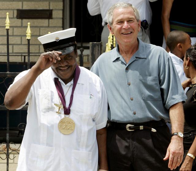 President George W. Bush (R) meets with musician Fats Domino in New Orleans, Louisiana, August 29, 2006. (REUTERS) President George W. Bush (R) meets with musician Fats Domino in New Orleans, Louisiana, August 29, 2006. (REUTERS)