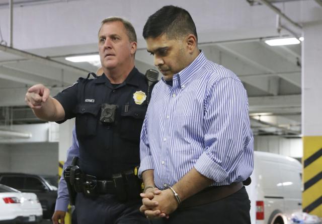 Wesley Mathews is escorted by police during his transfer to Dallas County jail in Dallas, Wednesday, Oct. 25, 2017. (AP) Wesley Mathews is escorted by police during his transfer to Dallas County jail in Dallas, Wednesday, Oct. 25, 2017. (AP)