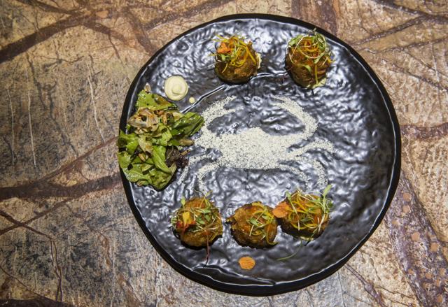 The crab cakes with jalapeno tartar sauce and arugula salad were disappointing. The cakes needed either more crab or less binder. (Pratik Chorge / HT Photo)