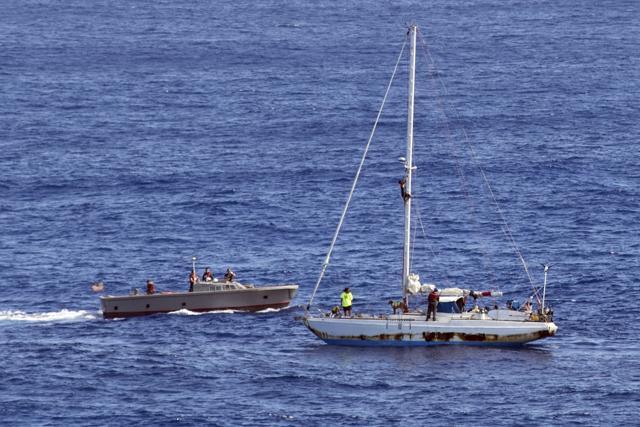 Sailors from the USS Ashland approach the sailboat with the two Honolulu women and their dogs as they are rescued after being lost at sea for five months while trying to sail from Hawaii to Tahiti. (AP) Sailors from the USS Ashland approach the sailboat with the two Honolulu women and their dogs as they are rescued after being lost at sea for five months while trying to sail from Hawaii to Tahiti. (AP)