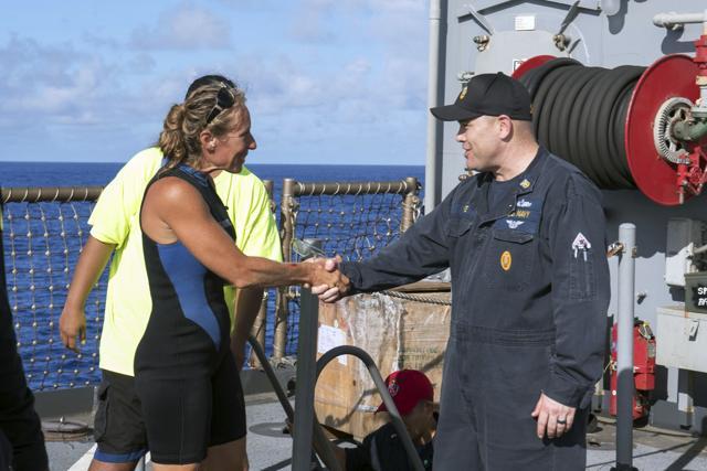 USS Ashland Command Master Chief Gary Wise welcomes aboard Jennifer Appel, an American mariner, one of the two Honolulu women and their dogs who were rescued after being lost at sea for several months while trying to sail from Hawaii to Tahiti. (AP) USS Ashland Command Master Chief Gary Wise welcomes aboard Jennifer Appel, an American mariner, one of the two Honolulu women and their dogs who were rescued after being lost at sea for several months while trying to sail from Hawaii to Tahiti. (AP)