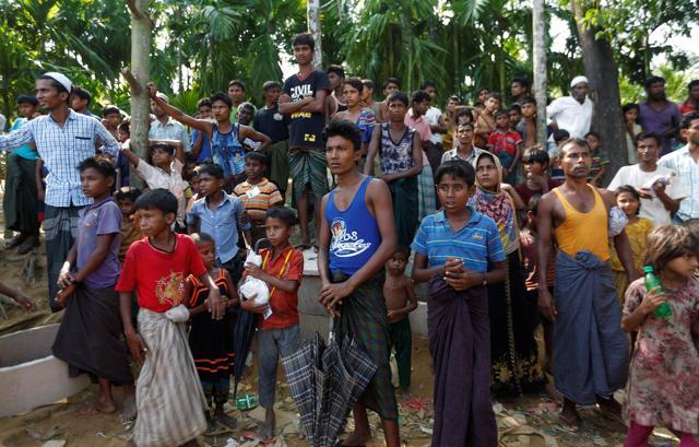 Rohingya refugees wait to receive humanitarian aid at Balu Khali refugee camp near Cox's Bazar, Bangladesh. (Reuters) Rohingya refugees wait to receive humanitarian aid at Balu Khali refugee camp near Cox's Bazar, Bangladesh. (Reuters)