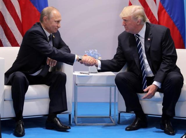 US President Donald Trump shakes hands with Russia's President Vladimir Putin during their bilateral meeting at the G20 summit in Hamburg, Germany. (Reuters File Photo)