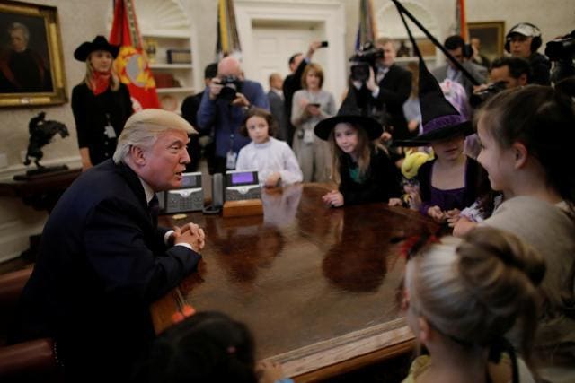 US President Donald Trump meets with children of members of press and White House staff as he gives out Halloween treats at the Oval Office of the White House in Washington, US, October 27, 2017. (REUTERS) US President Donald Trump meets with children of members of press and White House staff as he gives out Halloween treats at the Oval Office of the White House in Washington, US, October 27, 2017. (REUTERS)