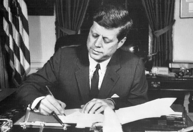 This file photo taken on October 24, 1962 shows US President John Fitzgerald Kennedy signing the order of naval blockade of Cuba at the White House in Washington, DC, during the Cuban missiles crisis. (AFP File) This file photo taken on October 24, 1962 shows US President John Fitzgerald Kennedy signing the order of naval blockade of Cuba at the White House in Washington, DC, during the Cuban missiles crisis. (AFP File)