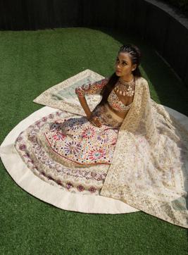 Mishra speaks about the zen-like feel in the collection, and this lehenga is a testament to his thought. The calming creams with just a dash of colour is reception-perfect. (Jasjeet Plaha/HT Photo)
