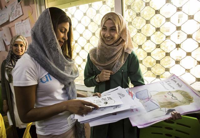 Priyanka Chopra, a UNICEF Goodwill Ambassador, views artwork by Eman Ahmad, right, from Aleppo, at UNICEF's Makani Center in Amman, Jordan. (AP) Priyanka Chopra, a UNICEF Goodwill Ambassador, views artwork by Eman Ahmad, right, from Aleppo, at UNICEF's Makani Center in Amman, Jordan. (AP)