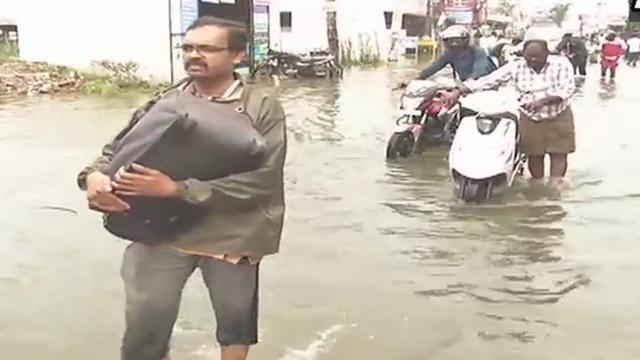 Locals wade through flood waters in Chennai’s Sunnambu Kolathur area on Friday. (ANI Twitter) Locals wade through flood waters in Chennai’s Sunnambu Kolathur area on Friday. (ANI Twitter)