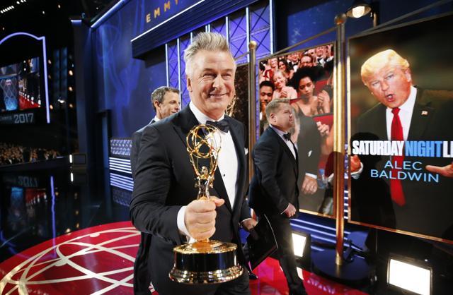 Alec Baldwin, winner of the award for outstanding supporting actor in a comedy series for Saturday Night Live, left, walks with James Corden on the red carpet stage at the 69th Primetime Emmy Awards on Sunday. (Invision for the Television Academy) Alec Baldwin, winner of the award for outstanding supporting actor in a comedy series for Saturday Night Live, left, walks with James Corden on the red carpet stage at the 69th Primetime Emmy Awards on Sunday. (Invision for the Television Academy)