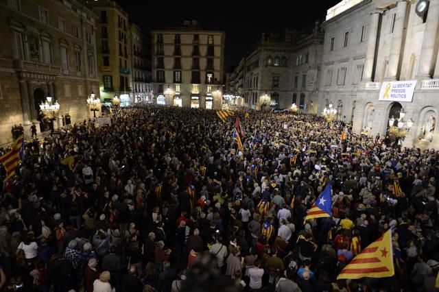Protesters wave Catalan pro-independence Estelada flags during a demonstration on Friday to protest against the detention of Catalan officials in Madrid. (AFP) Protesters wave Catalan pro-independence Estelada flags during a demonstration on Friday to protest against the detention of Catalan officials in Madrid. (AFP)