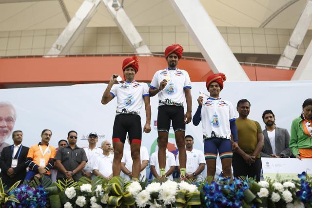 Satbir Singh (centre) after wining the National Cycling Championship. (HT Photo)