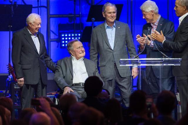 (L-R) Former US Presidents, Jimmy Carter, George H W Bush, George W Bush, Bill Clinton and Barack Obama attend the Hurricane Relief concert in College Station, Texas, on October 21, 2017. (AFP) (L-R) Former US Presidents, Jimmy Carter, George H W Bush, George W Bush, Bill Clinton and Barack Obama attend the Hurricane Relief concert in College Station, Texas, on October 21, 2017. (AFP)