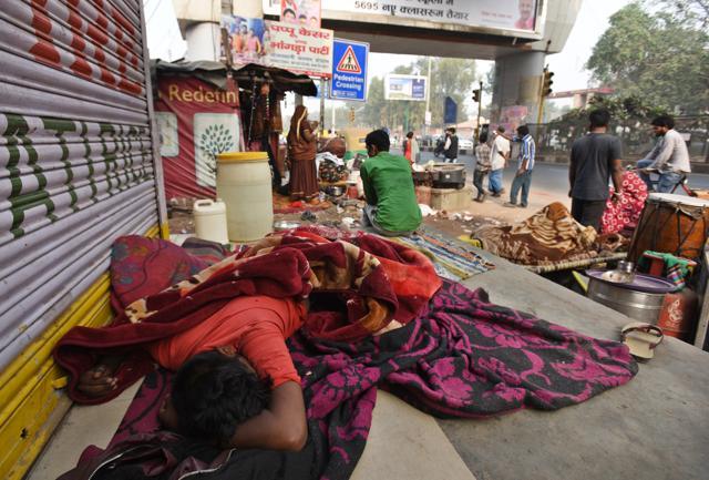 Locals of Kathputli Colony are living on the roads after its demolition . Locals of Kathputli Colony are living on the roads after its demolition .