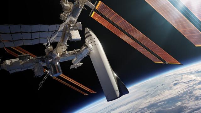This artist's rendering made available by Elon Musk shows SpaceX's new mega-rocket design at the International Space Station. (AP File Photo) This artist's rendering made available by Elon Musk shows SpaceX's new mega-rocket design at the International Space Station. (AP File Photo)