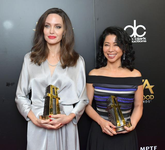 Honorees Angelina Jolie (L) and Loung Ung, recipients of the Hollywood Foreign Language Film Award for 'First They Killed My Father,' pose in the press room during the 21st Annual Hollywood Film Awards at The Beverly Hilton Hotel. (AFP) Honorees Angelina Jolie (L) and Loung Ung, recipients of the Hollywood Foreign Language Film Award for 'First They Killed My Father,' pose in the press room during the 21st Annual Hollywood Film Awards at The Beverly Hilton Hotel. (AFP)