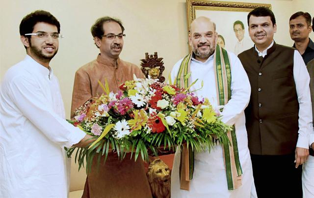 BJP National President, Amit Shah along with Maharashtra CM Devendra Fadnavis meets Shiv Sena President Uddhav Thackeray and his son Aditya Thackeray at Matoshree in Mumbai recently. Insiders in both the Sena and the BJP believe that the Sena will continue to target the BJP but will remain with the government. (PTI file photo) BJP National President, Amit Shah along with Maharashtra CM Devendra Fadnavis meets Shiv Sena President Uddhav Thackeray and his son Aditya Thackeray at Matoshree in Mumbai recently. Insiders in both the Sena and the BJP believe that the Sena will continue to target the BJP but will remain with the government. (PTI file photo)