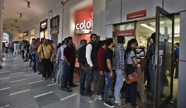 Queuing up for their own money on Sunday evening, November 13, 2016, at New Delhi. (Sanjeev Verma/HT Photo)