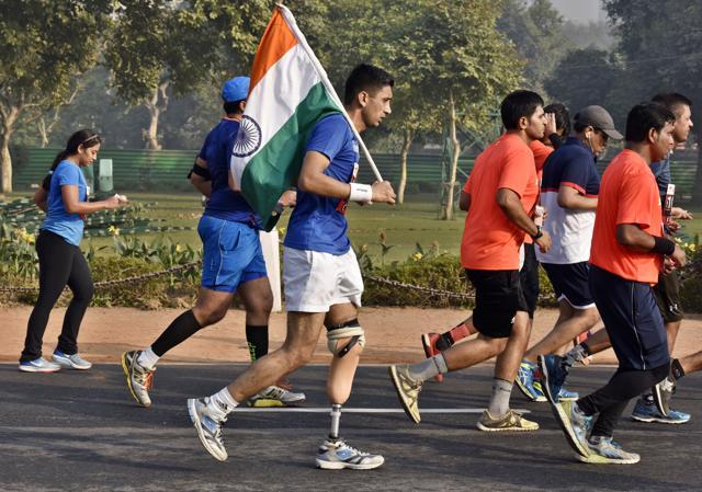 A physically challenge participant runs during the Airtel Delhi Half Marathon 2016. (Sanjeev Verma/HT PHOTO)
