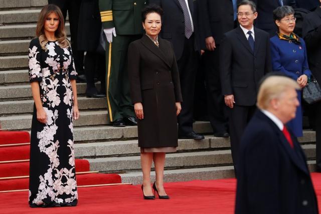 US first lady Melania Trump and China's First Lady Peng Liyuan watch as U.S. President Donald Trump takes part in a welcoming ceremony with China's President Xi Jinping in Beijing, China on November 9. (REUTERS) US first lady Melania Trump and China's First Lady Peng Liyuan watch as U.S. President Donald Trump takes part in a welcoming ceremony with China's President Xi Jinping in Beijing, China on November 9. (REUTERS)