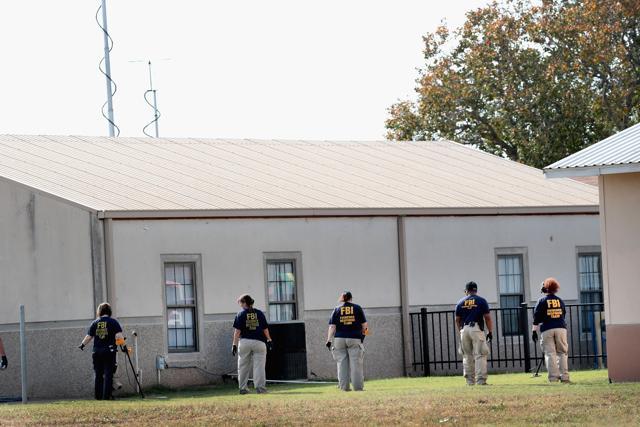 Law enforcement officials continue their investigation at the First Baptist Church of Sutherland Springs. (AFP Photo) Law enforcement officials continue their investigation at the First Baptist Church of Sutherland Springs. (AFP Photo)