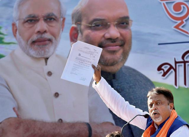 Former Trinamool leader Mukul Roy, who recently joined BJP, addresses a rally in Kolkata on Friday. (PTI)