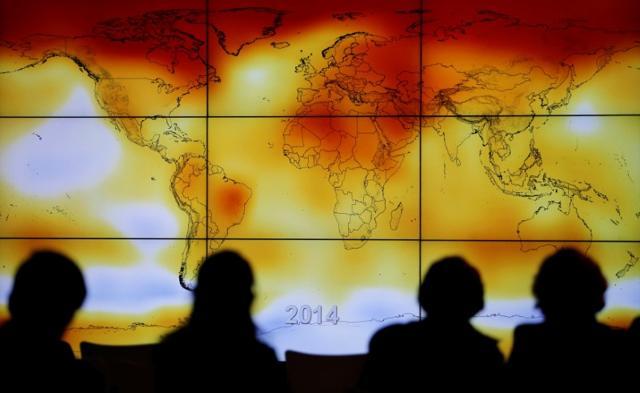 Participants are seen in silhouette as they look at a screen showing a world map with climate anomalies during the World Climate Change Conference 2015 (COP21) at Le Bourget, near Paris. (Reuters File Photo) Participants are seen in silhouette as they look at a screen showing a world map with climate anomalies during the World Climate Change Conference 2015 (COP21) at Le Bourget, near Paris. (Reuters File Photo)