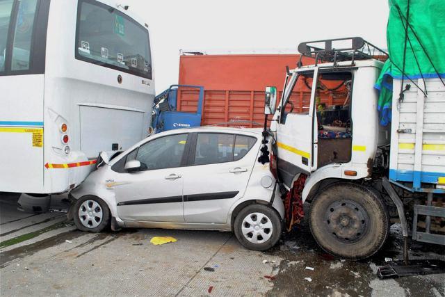Damaged vehicles at the accident site after 18 vehicles slammed into each other, due to poor visibiliy owing to dense smog at the Yamuna Expressway near Mathura . (PTI) Damaged vehicles at the accident site after 18 vehicles slammed into each other, due to poor visibiliy owing to dense smog at the Yamuna Expressway near Mathura . (PTI)