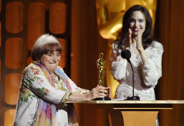 French film director Agnes Varda, left, collects her honorary Oscar onstage as presenter Angelina Jolie applauds at the 2017 Governors Awards at The Ray Dolby Ballroom on Saturday, November 11. (Chris Pizzello/Invision/AP) French film director Agnes Varda, left, collects her honorary Oscar onstage as presenter Angelina Jolie applauds at the 2017 Governors Awards at The Ray Dolby Ballroom on Saturday, November 11. (Chris Pizzello/Invision/AP)