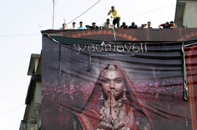 Members of Akhil Bhartiya Chatriya Mahasabha and other Hindu groups tear the hoarding of Sanjay Leela Bhansali’s Padmavati during their protest at Ratu road in Ranchi on November 12, 2017. (Diwakar Prasad/ HT Photo)