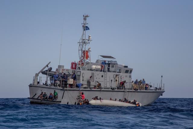 The Libyan Coast Guard tries to recover migrants from a rubber dinghy in the Mediterranean Sea. (AFP Photo/Alessio Paduano) The Libyan Coast Guard tries to recover migrants from a rubber dinghy in the Mediterranean Sea. (AFP Photo/Alessio Paduano)