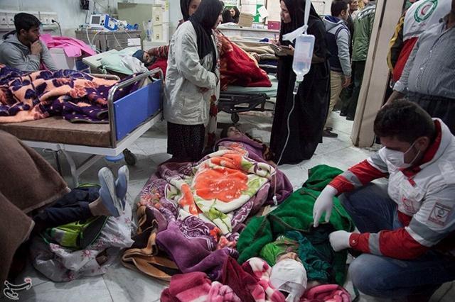 People receive medical treatment following the earthquake. The army set up field hospitals, although many of the injured were moved to other cities, including Tehran. (REUTERS) People receive medical treatment following the earthquake. The army set up field hospitals, although many of the injured were moved to other cities, including Tehran. (REUTERS)