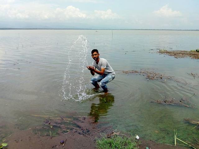 A tourist poses for camera at Nanak Sagar Dam in Uttarakhand. Spread over 39,000 hectares, Nanak Sagar Dam was built in 1962 and its water caters to plains of Uttar Pradesh. (HT Photo) A tourist poses for camera at Nanak Sagar Dam in Uttarakhand. Spread over 39,000 hectares, Nanak Sagar Dam was built in 1962 and its water caters to plains of Uttar Pradesh. (HT Photo)