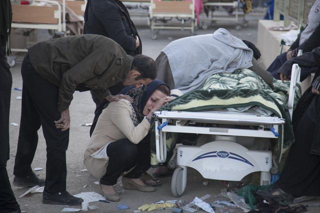 Iranians mourn over the body of a victim following an earthquake in Sarpol-e Zahab in Iran. Over 400 died in the 7.3 magnitude earthquake. (AFP) Iranians mourn over the body of a victim following an earthquake in Sarpol-e Zahab in Iran. Over 400 died in the 7.3 magnitude earthquake. (AFP)