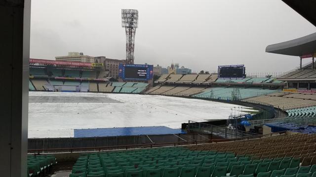 The Eden Gardens pitch was kept under covers because of the sudden rainfall in Kolkata. (HT Photo) The Eden Gardens pitch was kept under covers because of the sudden rainfall in Kolkata. (HT Photo)
