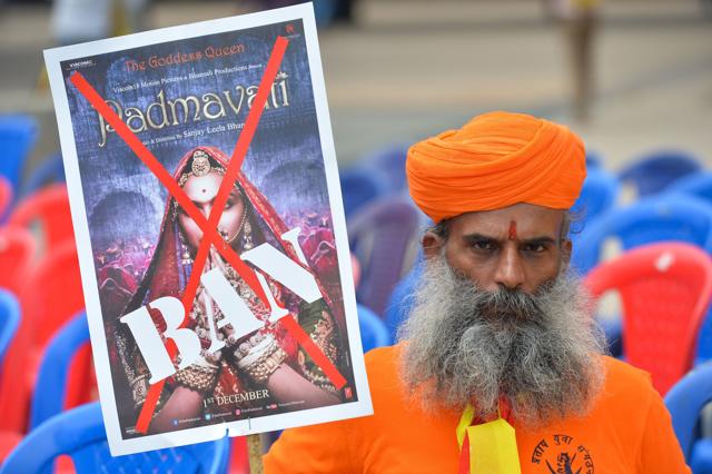 An activists of the Karnataka wing of Rashtriya Rajput Karni Sena caste organisation holds a placard demanding the ban on screening of Bollywood movie Padmavati, in Bangalore. (AFP) An activists of the Karnataka wing of Rashtriya Rajput Karni Sena caste organisation holds a placard demanding the ban on screening of Bollywood movie Padmavati, in Bangalore. (AFP)