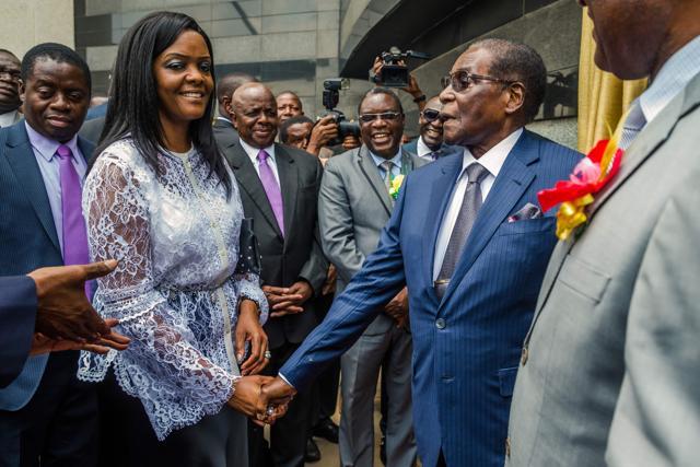 Zimbabwean President Robert Mugabe with First Lady Grace Mugabe after he unveiled a plaque at the country's main international airport in Harare, renamed after him on November 9, 2017. (AFP Photo) Zimbabwean President Robert Mugabe with First Lady Grace Mugabe after he unveiled a plaque at the country's main international airport in Harare, renamed after him on November 9, 2017. (AFP Photo)