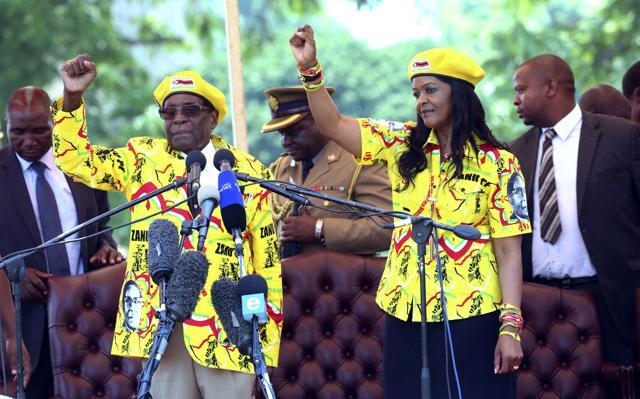 Zimbabwe's President Robert Mugabe and his wife Grace chant the party's slogan during a solidarity rally in Harare. (AP File Photo) Zimbabwe's President Robert Mugabe and his wife Grace chant the party's slogan during a solidarity rally in Harare. (AP File Photo)
